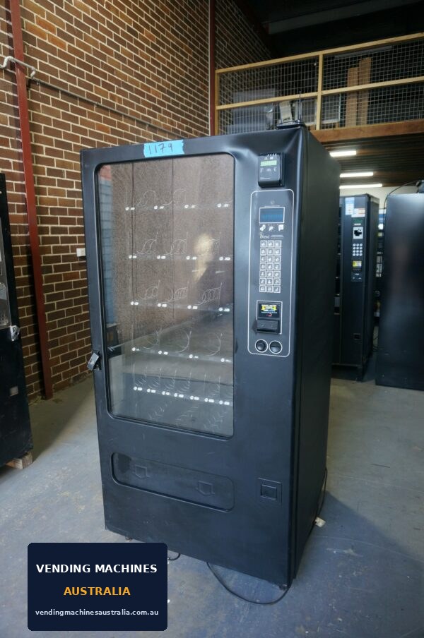 Photograph of 5-wide snack machine — damaged, unit reference 1179